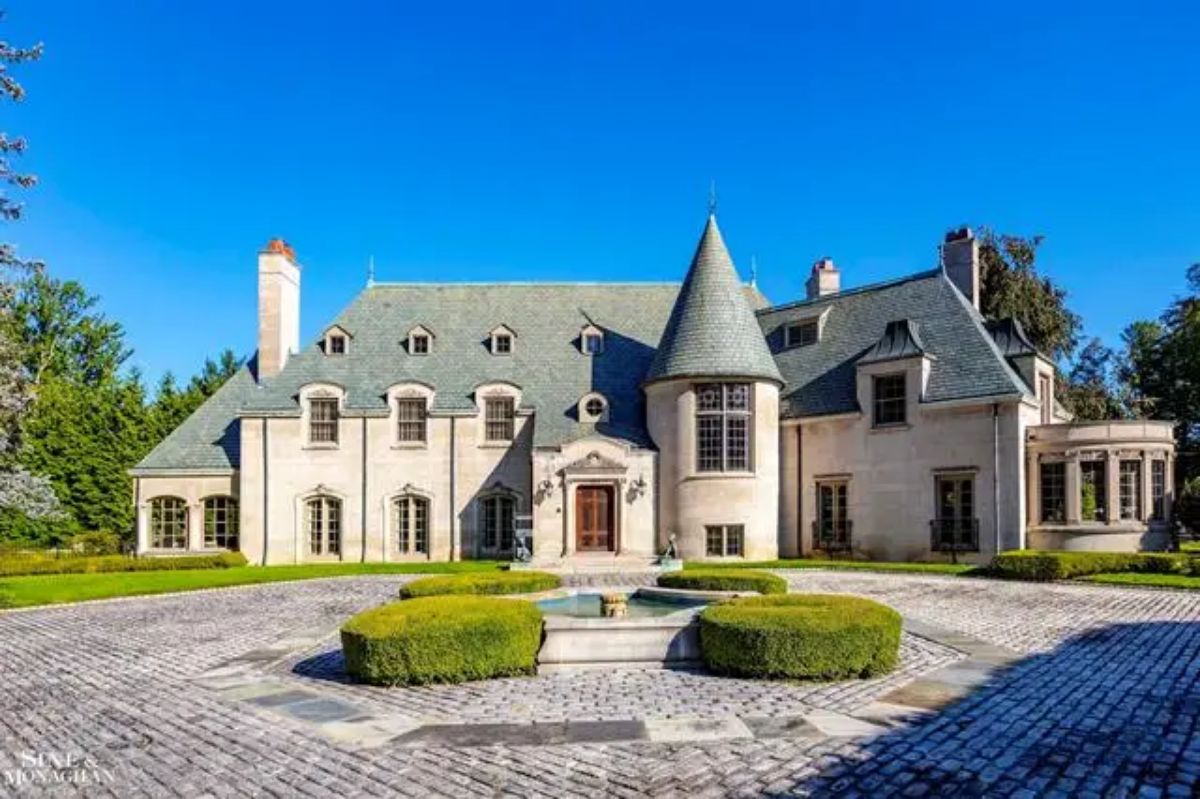 Situated among the grand estates of Grosse Pointe Farms, this 1928 French Norman Chateau by architect Alvin E. Harley exudes timeless elegance and historic significance.