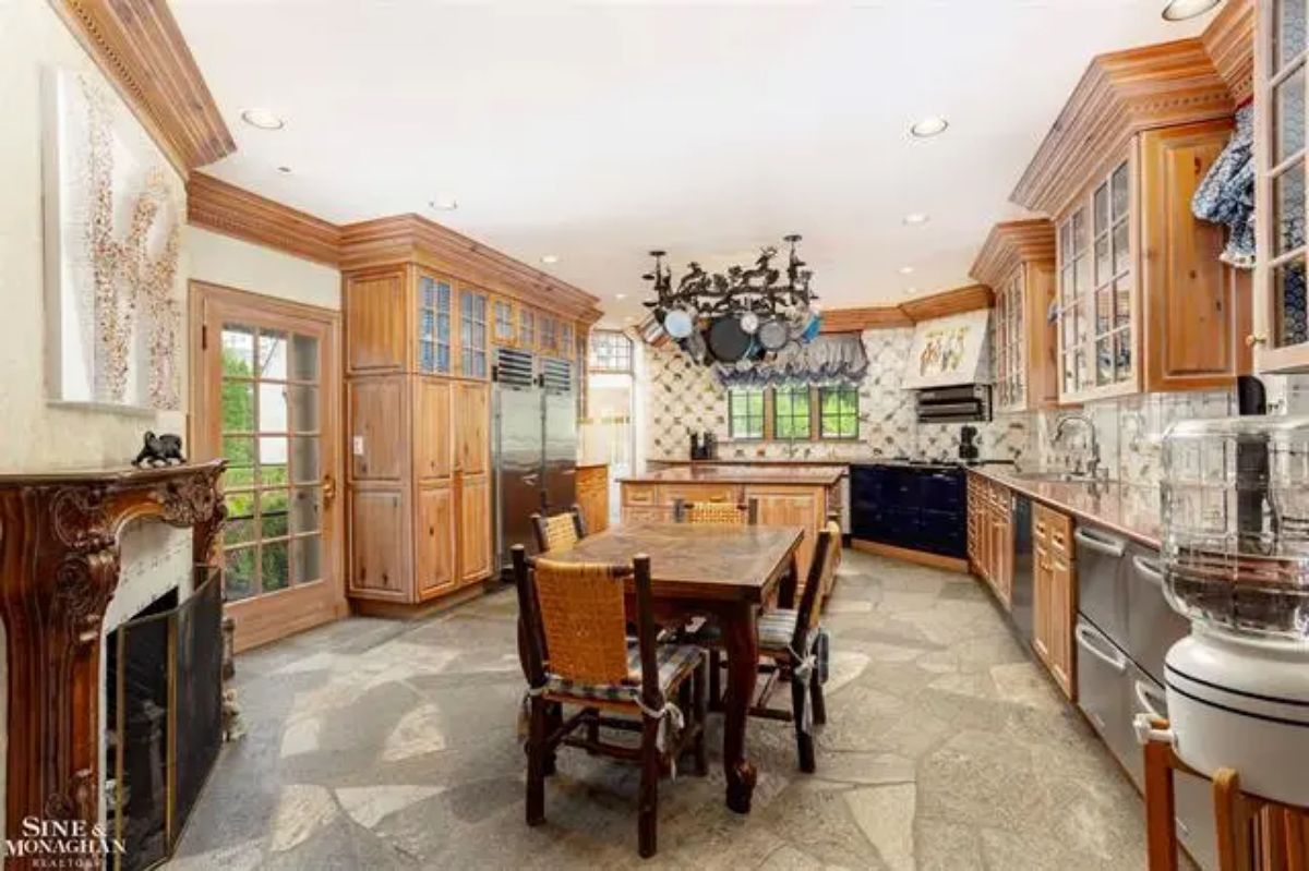 Natural wood cabinetry and a large central island.