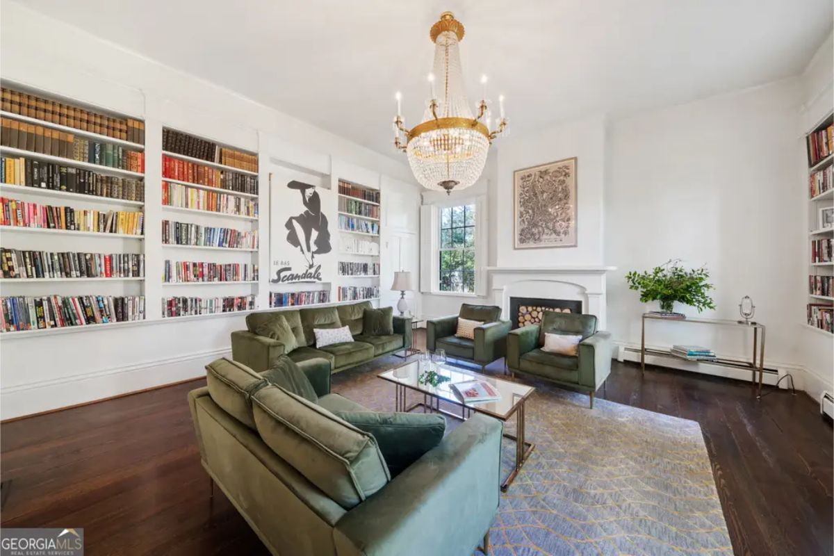 Floor-to-ceiling built-in bookshelves filled with an extensive collection of books, creating a cozy library vibe.