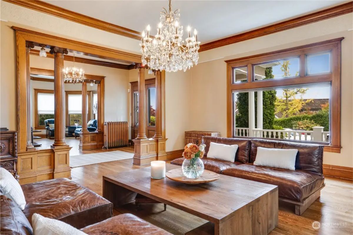 Living room showcases crystal chandeliers, adding elegance and charm.