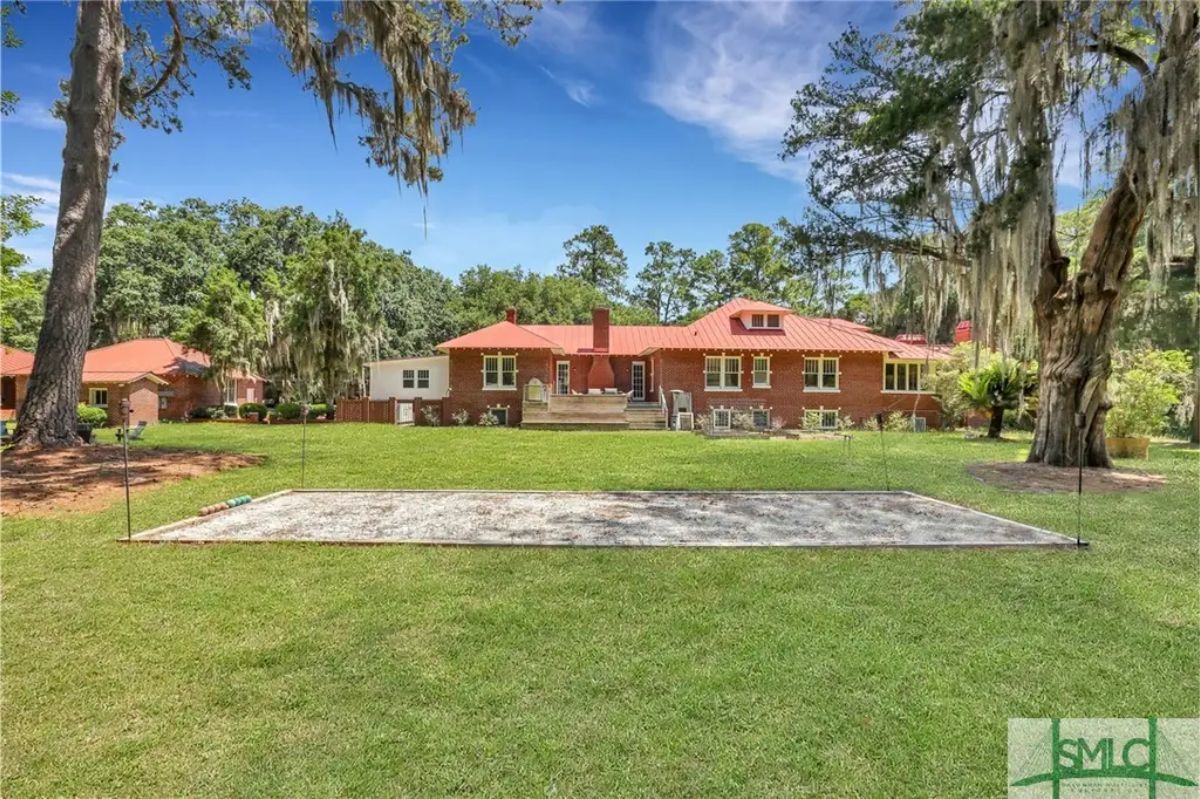 Priced at $4,000,000, the Hi/Lo House is an 8,332 sq ft waterfront estate built in 1928, featuring 5 bedrooms and 5 bathrooms on 12.8 acres in Savannah, GA.