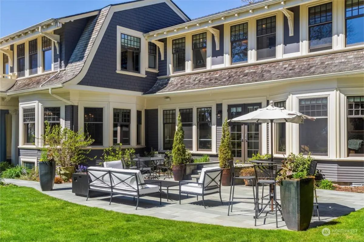 Spacious kitchen features a large wooden-topped island with seating.