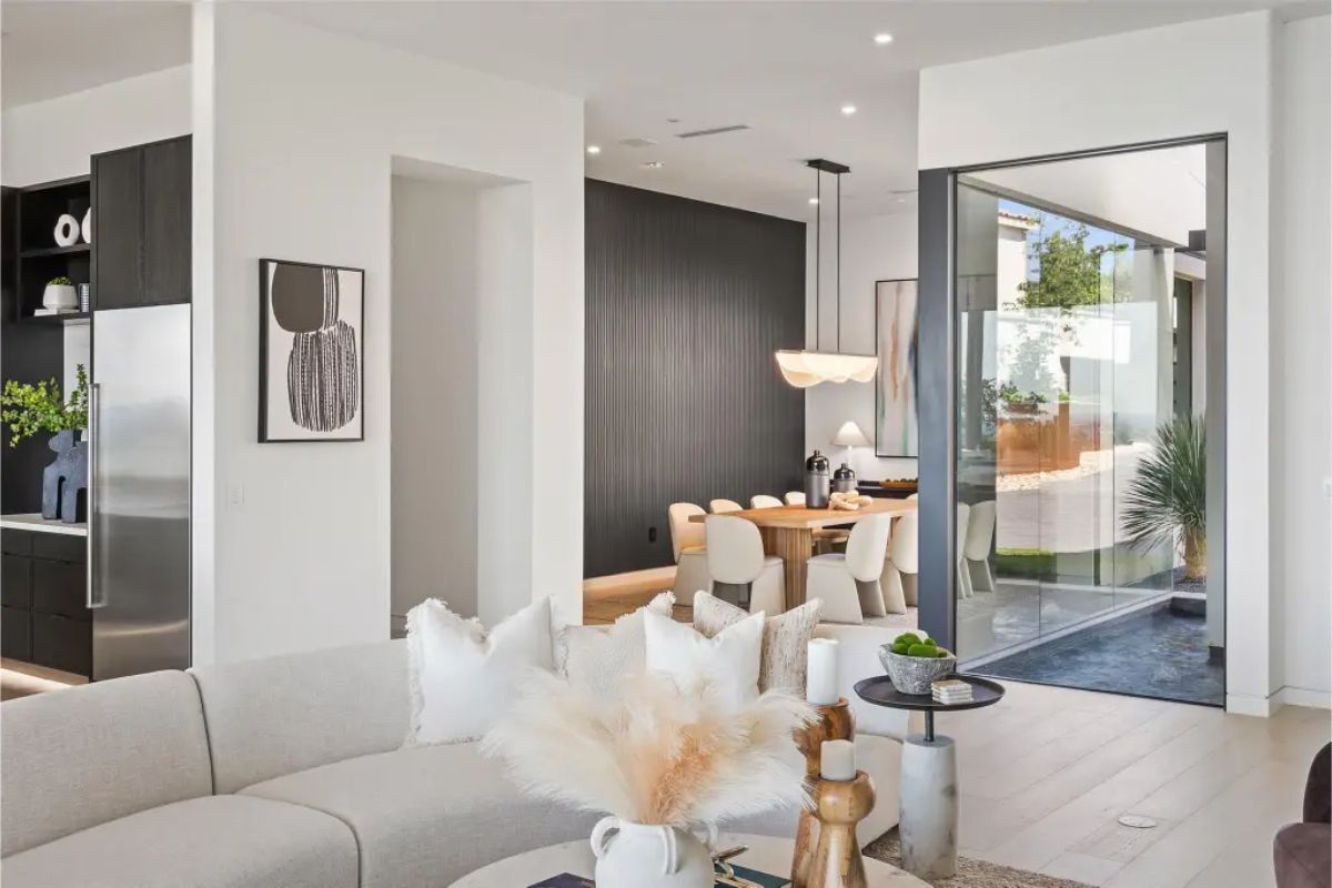 Bright kitchen and dining space with modern decor and clean lines. 