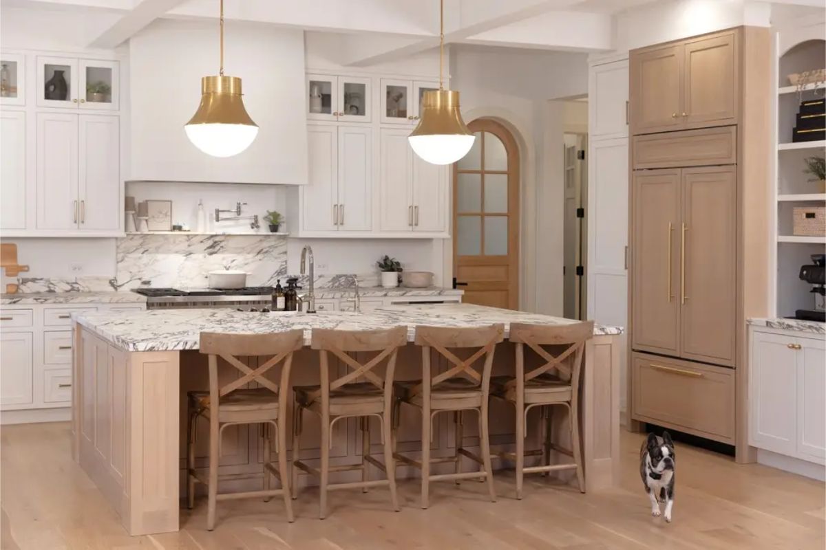 Blend of white cabinetry and light wood tones for a clean, modern look.