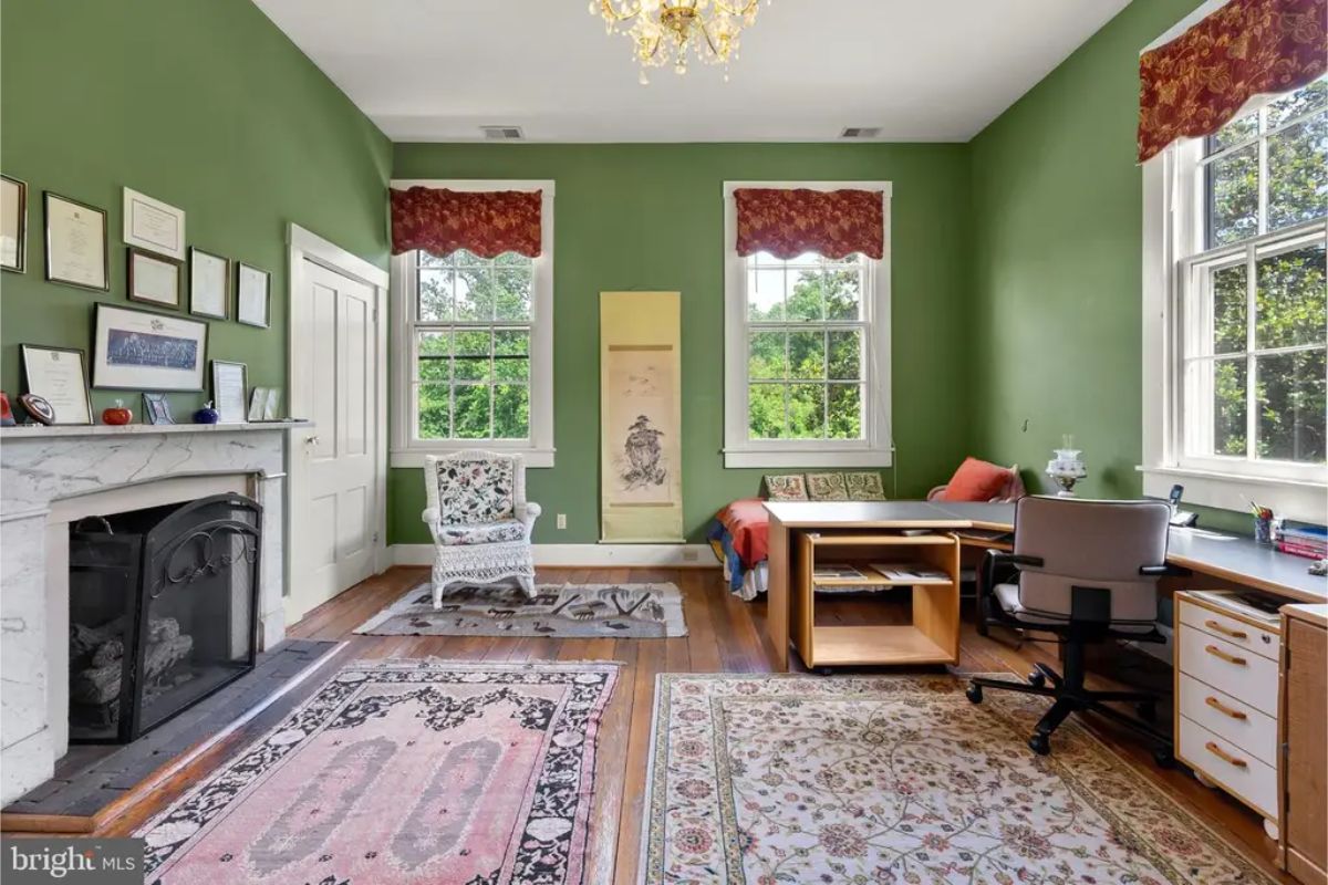 Green walls create a refreshing atmosphere in this home office.
