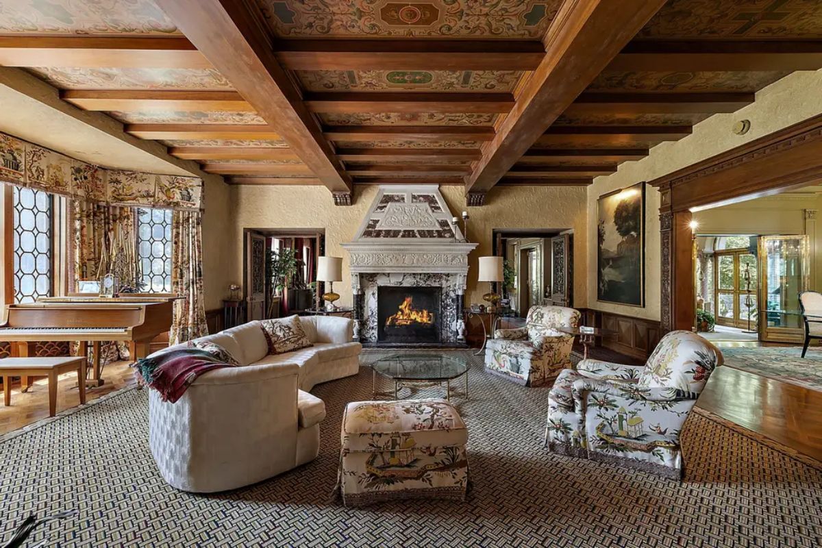 Grand carved fireplace as its focal point, adding a touch of sophistication.