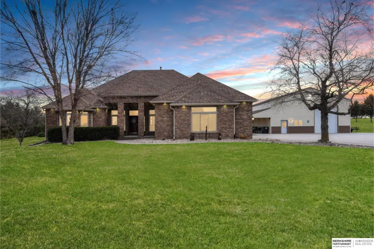 All this for $999,500 in Papillion. This stunning 5-bedroom, 5-bathroom ranch-style home offers 5,804 sq. ft. of living space on nearly 5 serene acres, complete with dual heating/cooling systems, walk-in closets, and a four-season patio room.