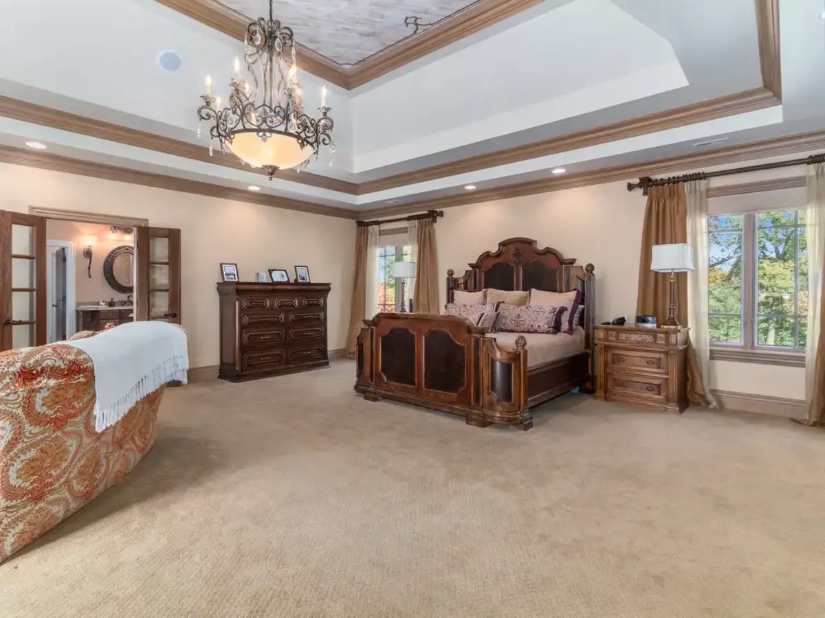 Tray ceilings draw the eye upward, creating a sense of openness in the master bedroom.
