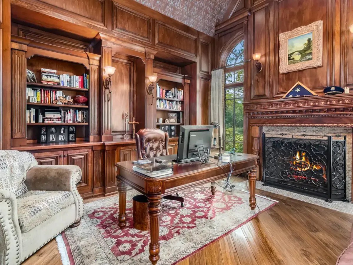 Warm wood paneling lines the walls, creating a traditional study ambiance.