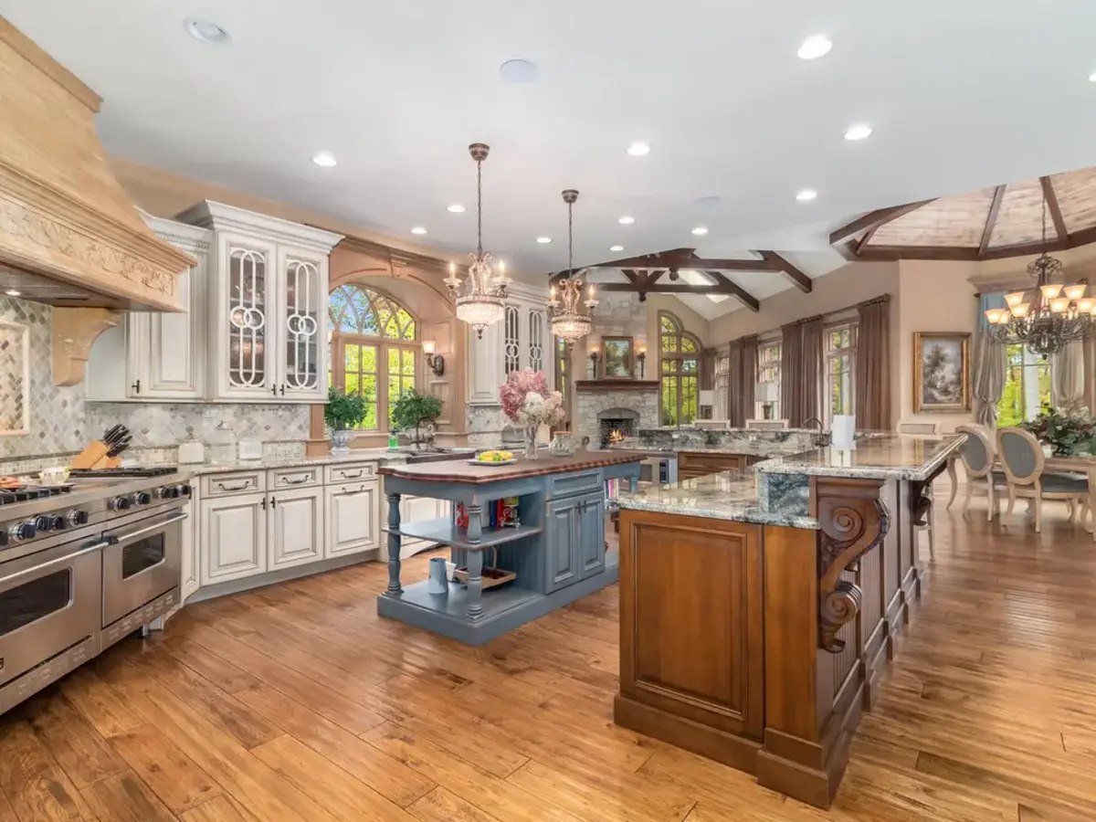 Kitchen features a large center island designed for meal prep and informal dining.