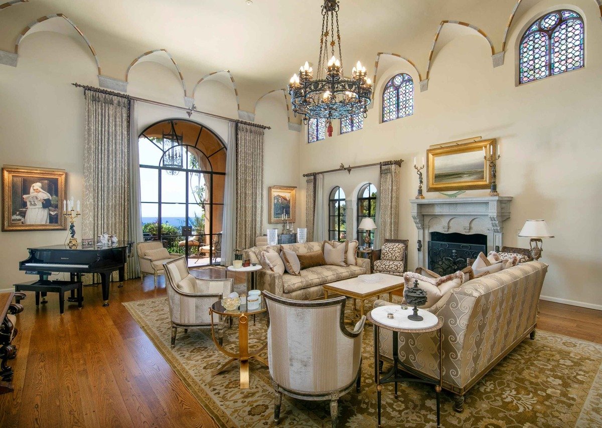 High vaulted ceilings with exposed detailing add architectural character to the living room.