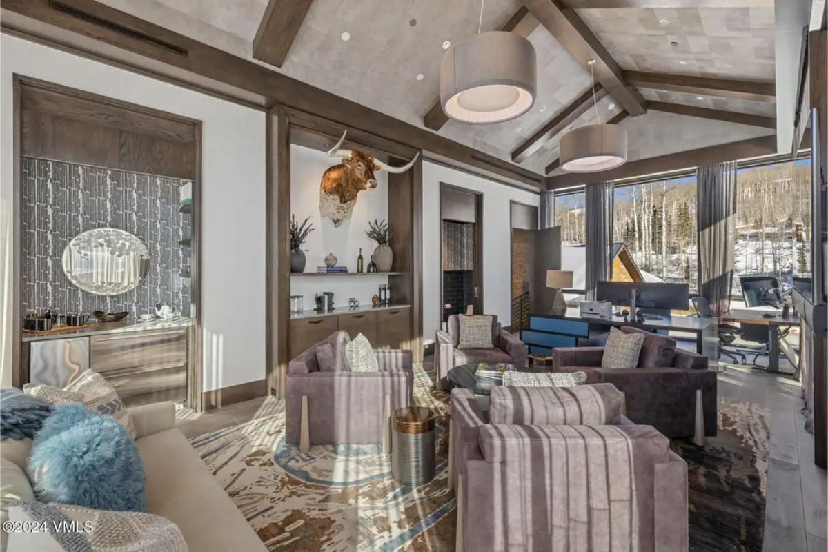 This sophisticated sitting area combines plush armchairs and textured decor to create a comfortable yet elegant ambiance