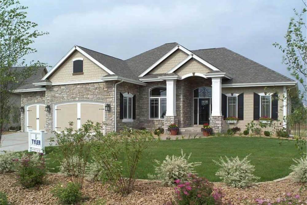 Classic Suburban Home with Stately Columns and Stone Facade