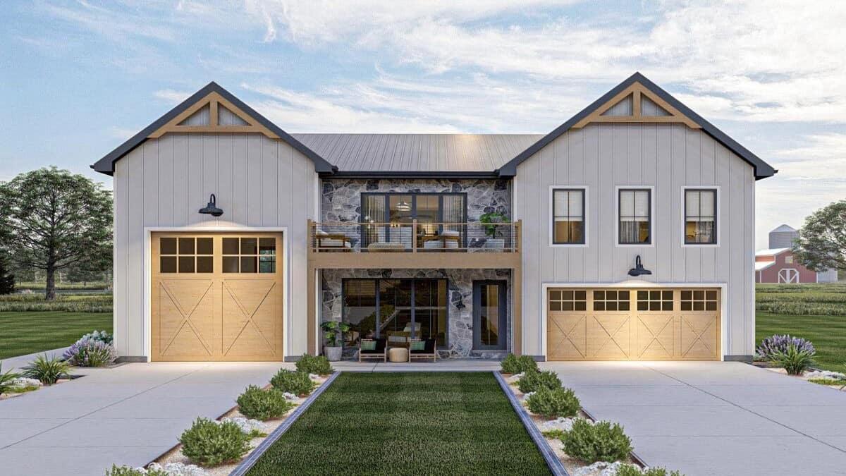 Farmhouse Facade with Charming Stonework and Dual Garages