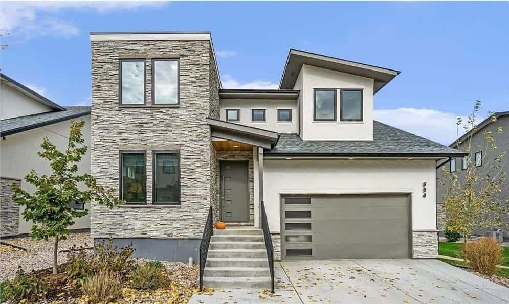 Modern Facade with Striking Stone Accents and Asymmetrical Design