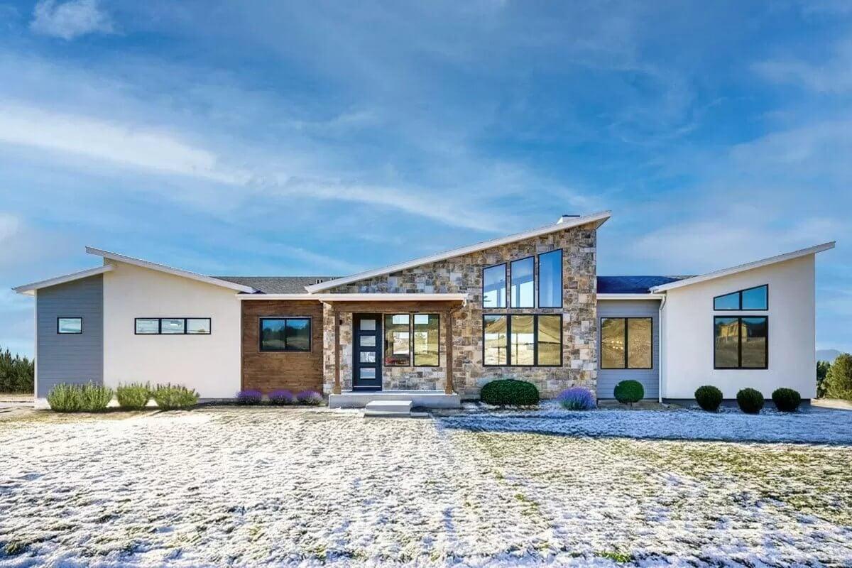 Modern Ranch with Striking Stone Facade and Asymmetrical Rooflines