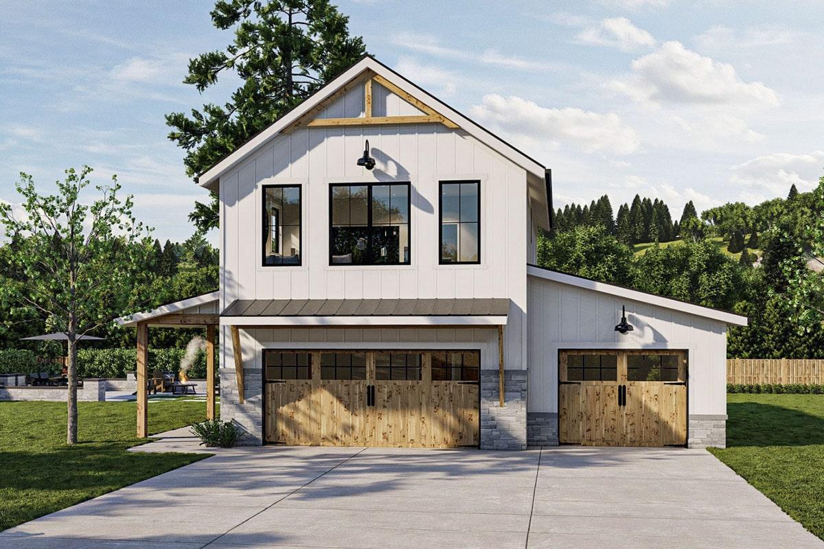 Notice the Contrasting Wooden Garage Doors on This Modern Farmhouse