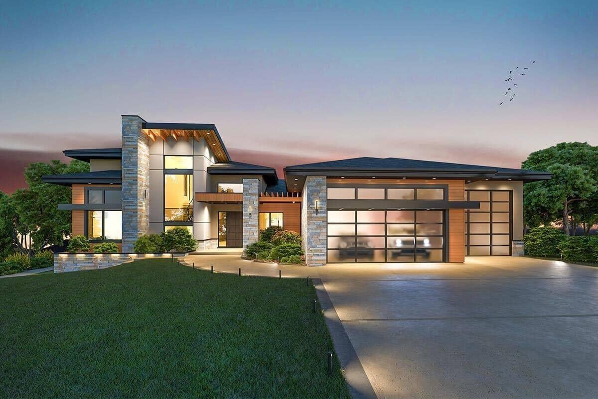 Contemporary Home with Striking Stone Accents and Expansive Glass Garage Doors