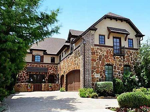 Rustic Elegance: Stone Facade with Distinctive Arched Windows