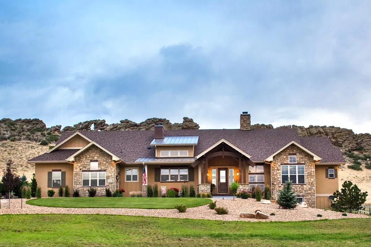 Rustic Ranch Home Nestled Against a Dramatic Rocky Backdrop