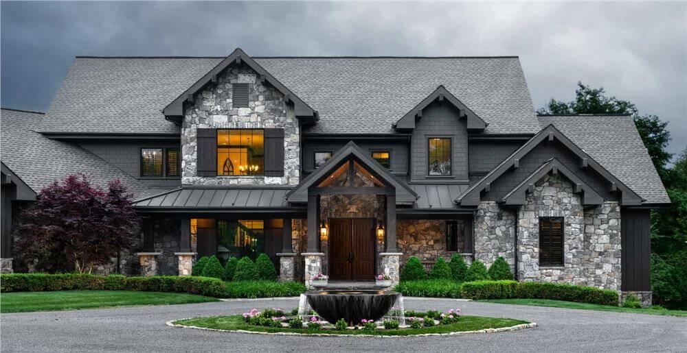 Rustic Elegance with Stone Facade and Dramatic Rooflines