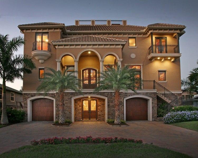 Mediterranean Revival Home with Striking Arched Entrances