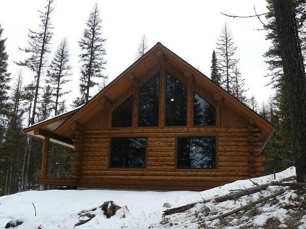 Cozy Log Cabin Nestled in a Winter Wonderland