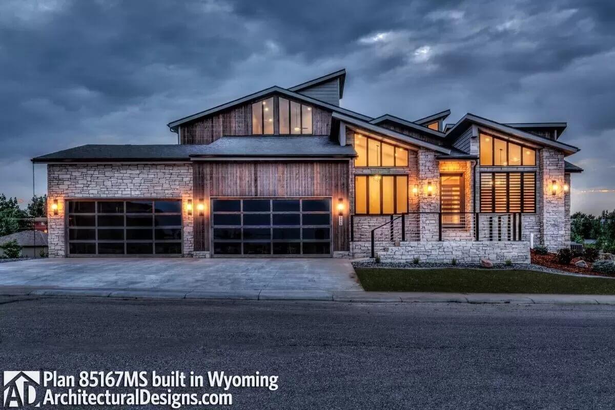 Striking Contemporary Home with Layered Rooflines and Stone Facade