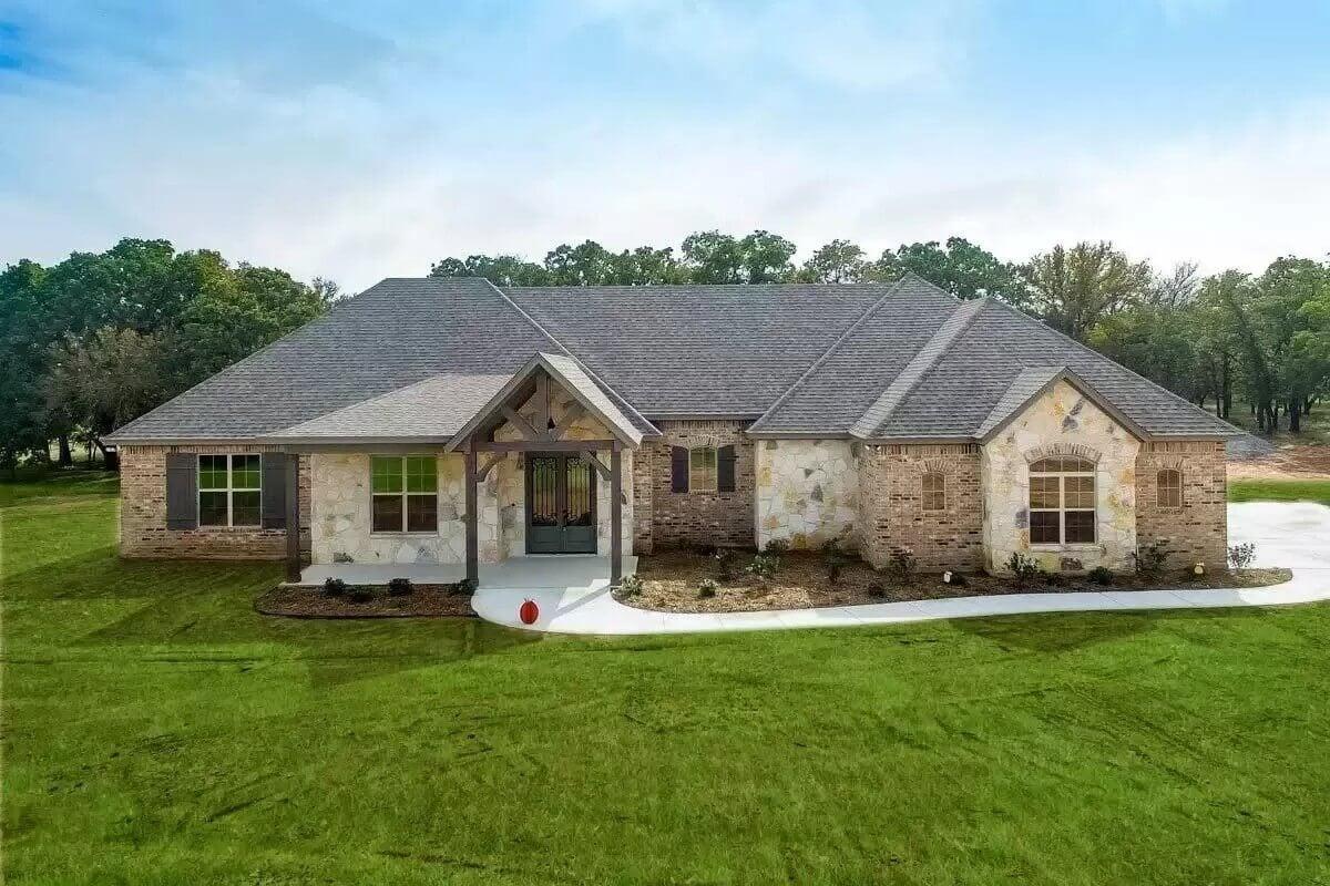 Classic Ranch Style with a Stone Facade and Gabled Entryway
