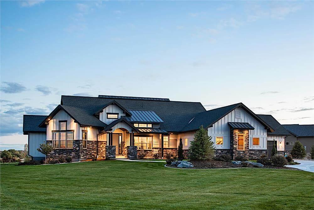 Modern Farmhouse with Striking Stone Accents at Sunset