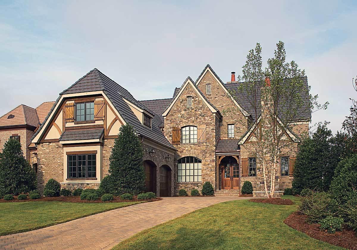 Discover the Timeless Appeal of This Stone-Clad Tudor Revival Home