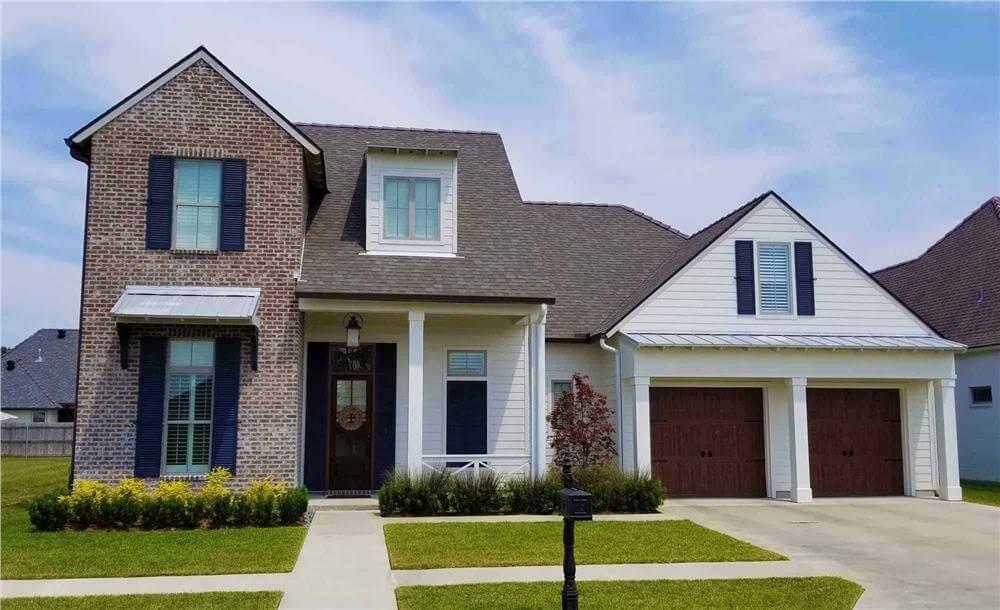 Classic Brick and Siding Façade with Twin Garage Doors