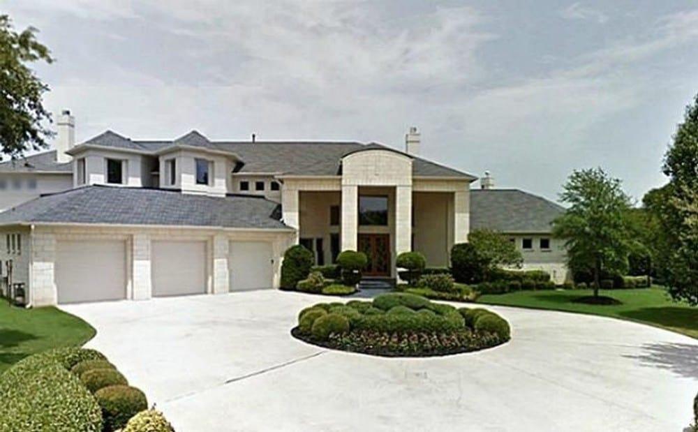 Grand Two-Story Home with Circular Driveway and Triple Garage