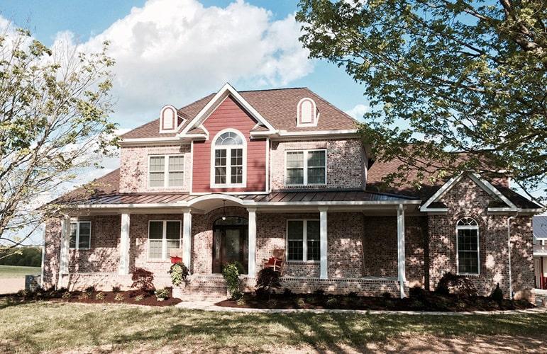 Elegant Two-Story Home with a Striking Red Gable Accent