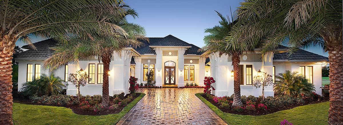 Stately Mediterranean Villa with Lush Palm-Lined Driveway