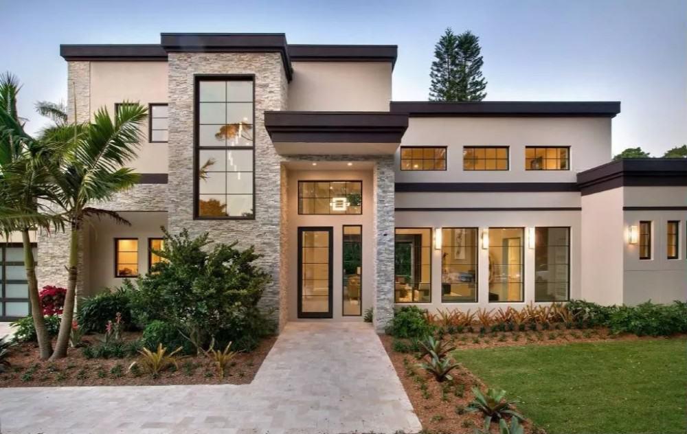 Modern Facade with Striking Stone Accents and Expansive Windows