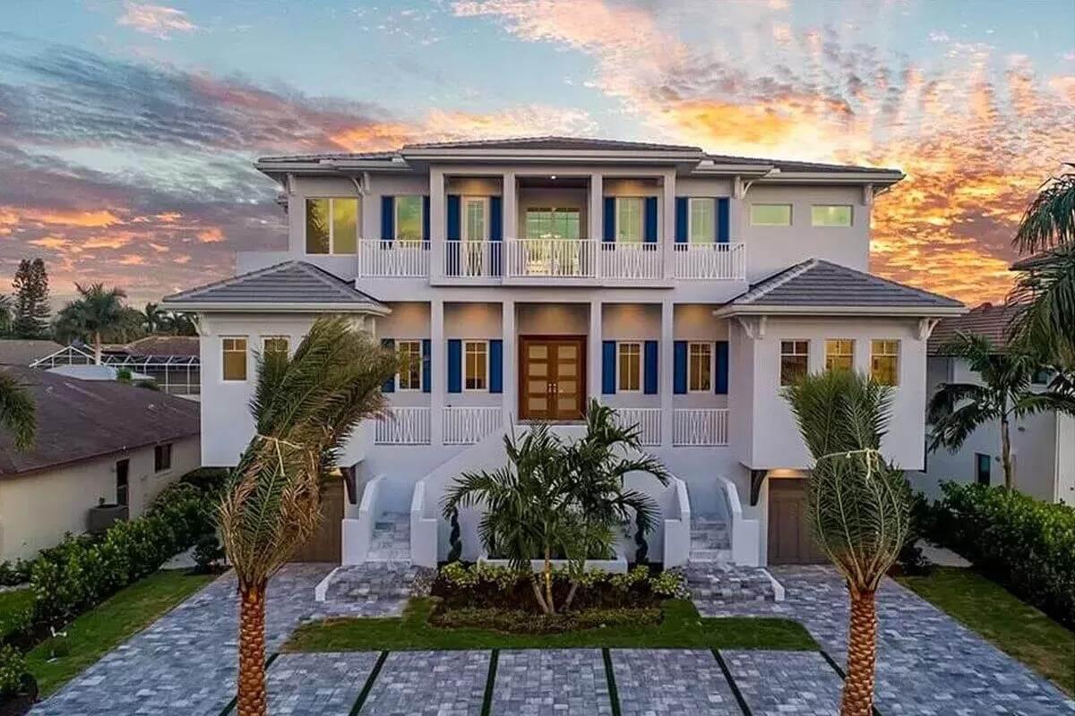 Grand Coastal Home with Striking Double Staircase Entry