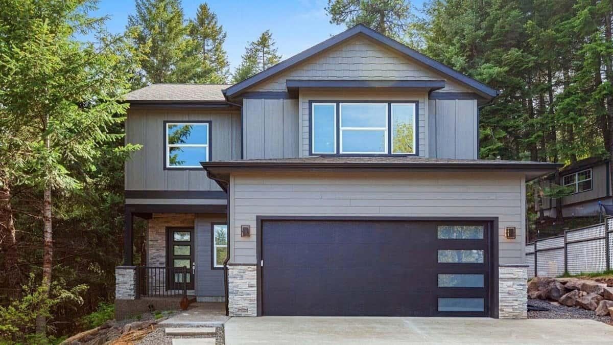 Modern Two-Story Home with Striking Black Garage Door