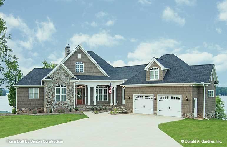 Lakeside Beauty with Stone Accents and Dormer Windows