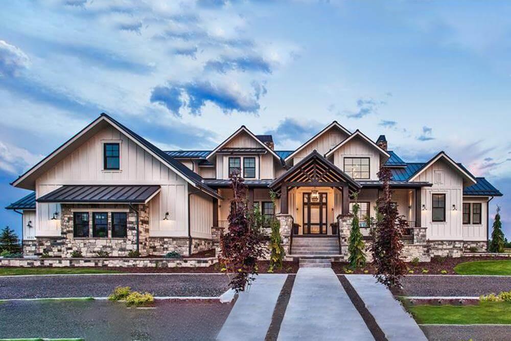 Modern Farmhouse with Striking Gable Roofs and Stone Accents