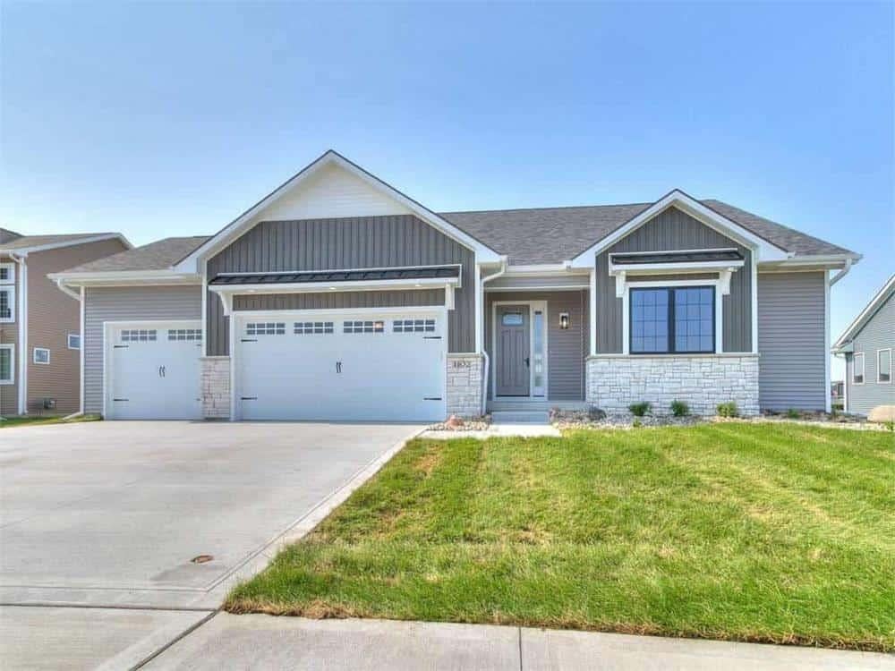 Classic Ranch-Style Home with Stone Accents and Triple Garage