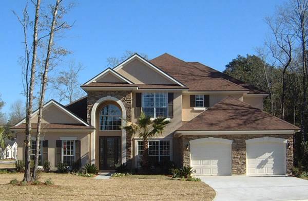 Grand Entrance and Stone Accents Define This 4-Bedroom Home