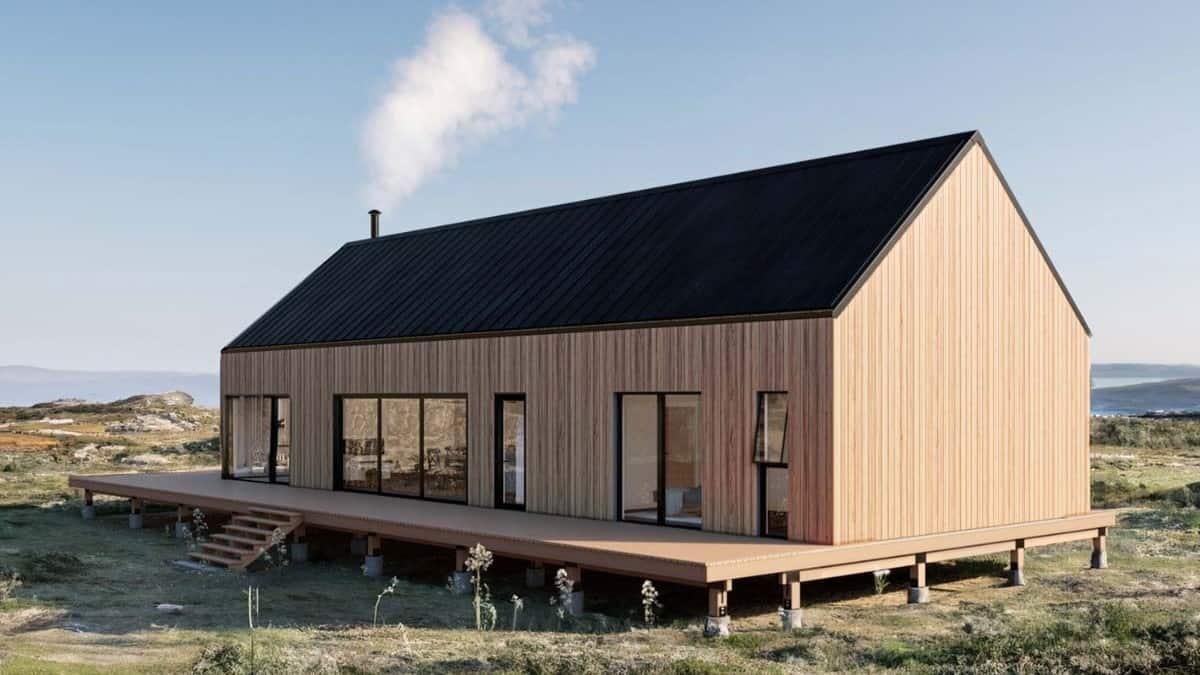 Minimalist Cabin with a Black Gabled Roof and Expansive Deck