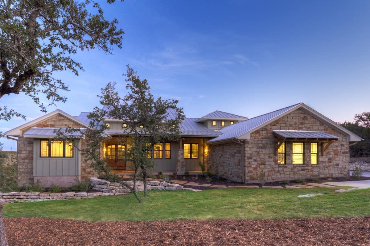 Charming Stone Ranch House with Metal Roof Accents