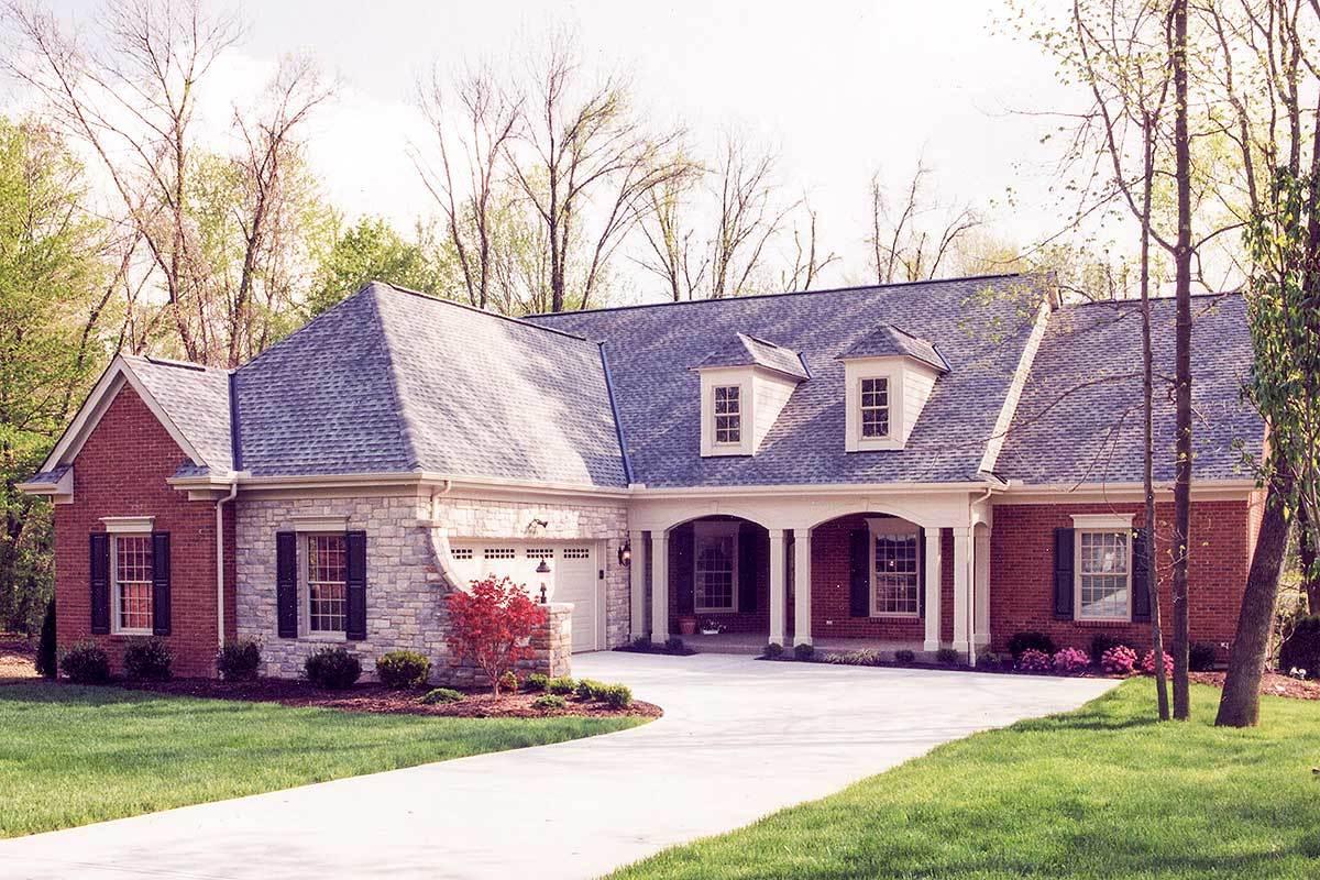 Classic Brick and Stone Ranch with Elegant Dormer Windows