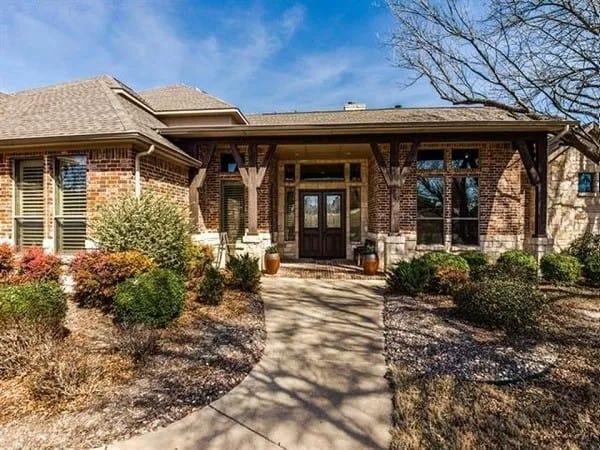 Classic Brick Facade with Timber Accents and Inviting Pathway