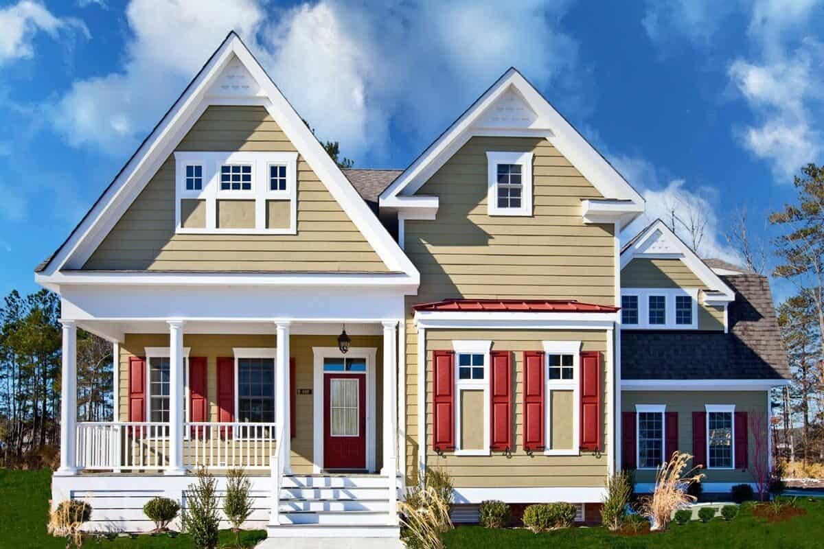 Classic Home with Bold Red Shutters and a Welcoming Porch