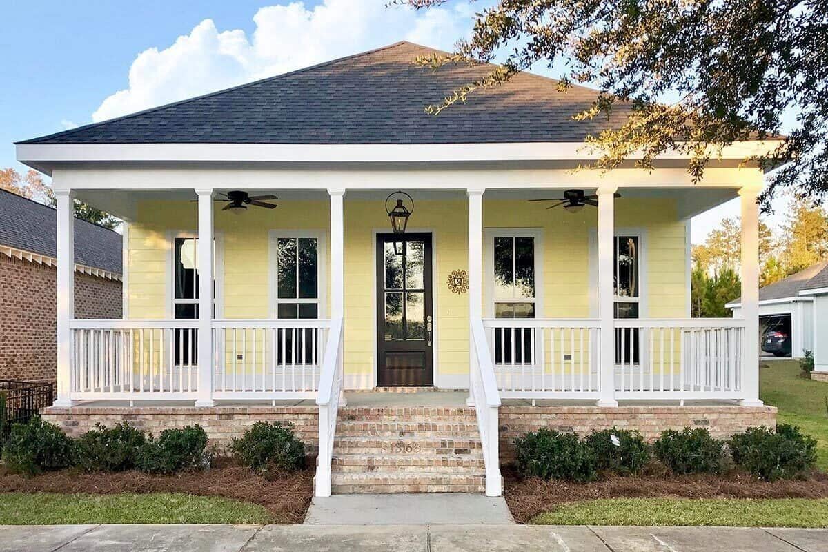 Charming Front Porch with Classic Columns and Brick Steps