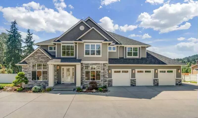 Classic Suburban Elegance with Stone Accents and Triple Garage
