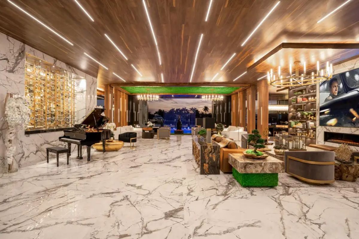 Living area features marble flooring, wood-paneled ceilings, and recessed LED lighting.